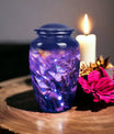 Elegant purple memorial urn featuring a butterfly design, utilized for adult women's ashes burial