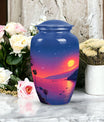 Medium-sized blue cremation urn with sun design, suitable for both men and women to memorialize human ashes