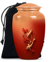 Gold fish urn with butterfly theme, ideal for memorial ashes