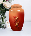 Gold fish urn with butterfly theme, ideal for memorial ashes