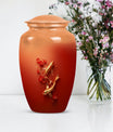 Gold fish urn with butterfly theme, ideal for memorial ashes