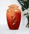 Gold fish urn with butterfly theme, ideal for memorial ashes