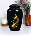 large gold fish cremation urn.