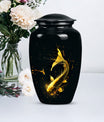 large gold fish cremation urn.