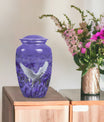 white dove on purple urn with butterfly theme.