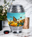 Large Butterflies Urn for adult human ashes, crafted from aluminium, personalizable with engraved names, a product of Monar_Urn