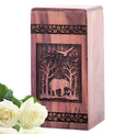 Large wooden urn featuring an elephant design, suitable for storing adult male human ashes.