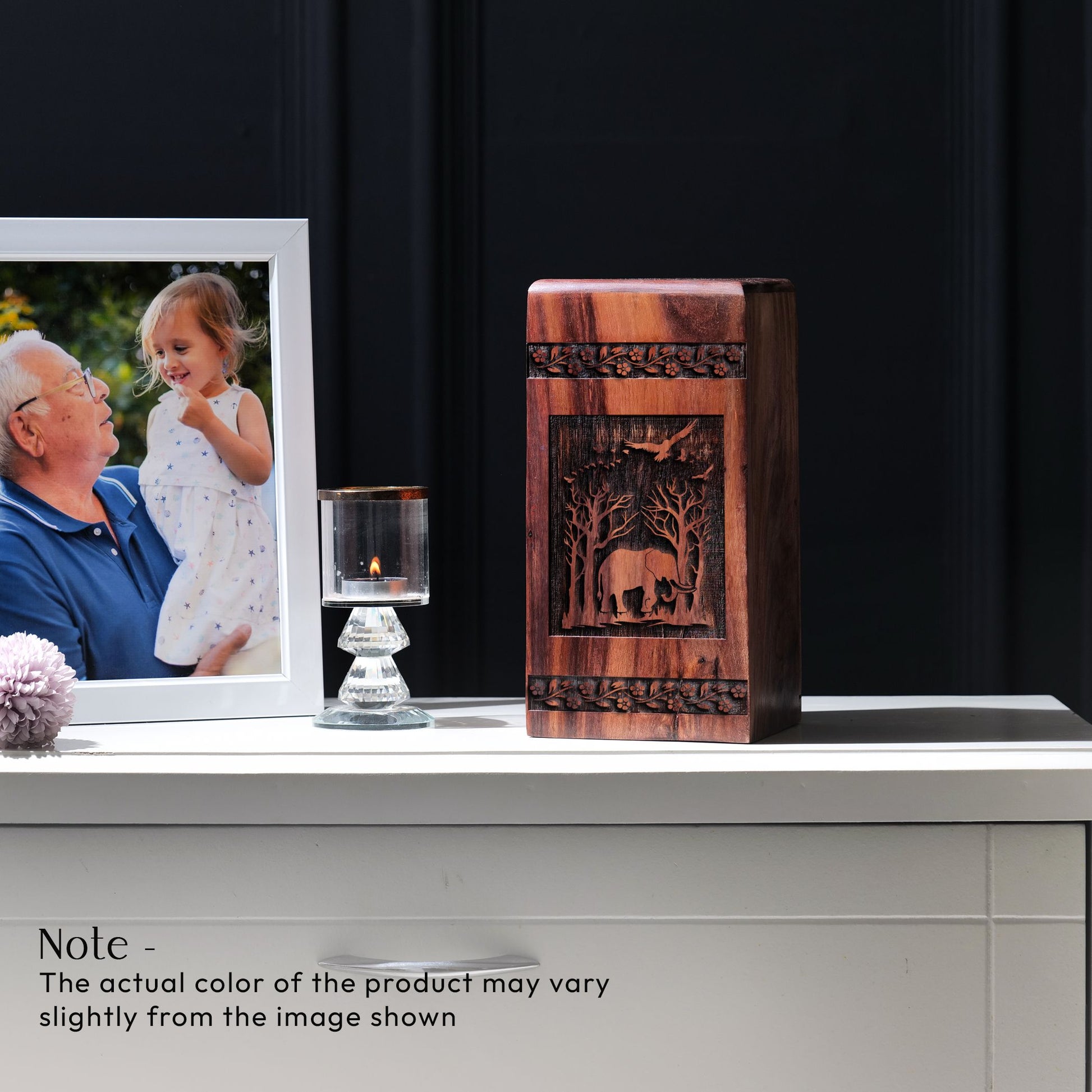 Large wooden urn featuring an elephant design, suitable for storing adult male human ashes.