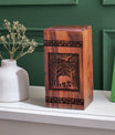 Large wooden urn featuring an elephant design, suitable for storing adult male human ashes.